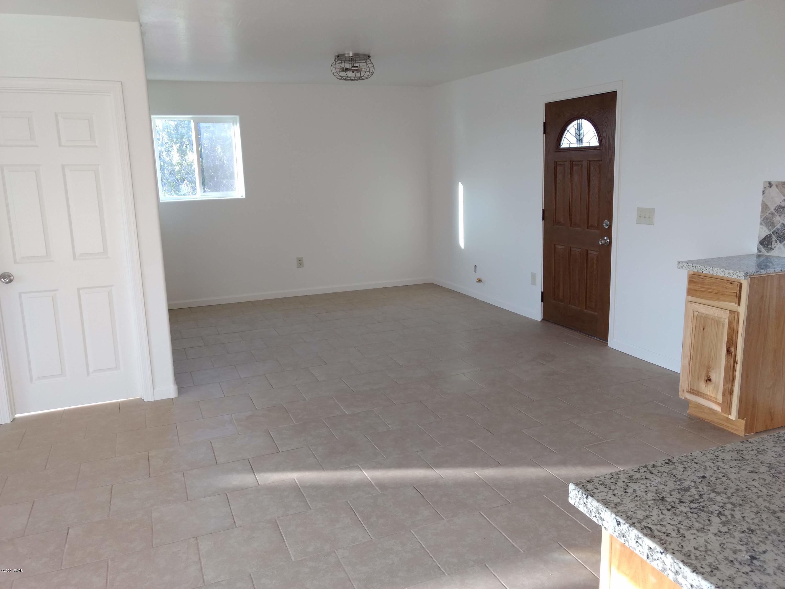 9 County Road Show Low, AZ 85901 - Photo 12 of 46 an empty room with windows