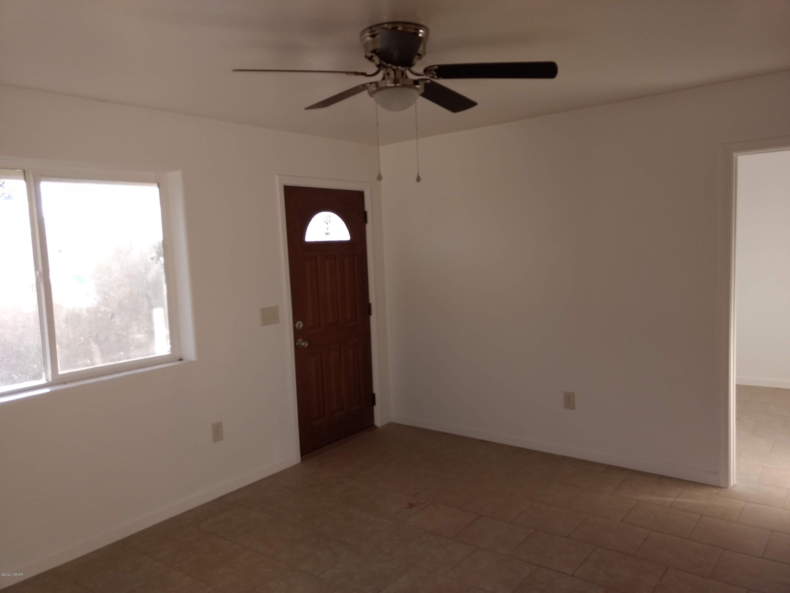 9 County Road Show Low, AZ 85901 - Photo 20 of 46 a view of a livingroom with a ceiling fan and window