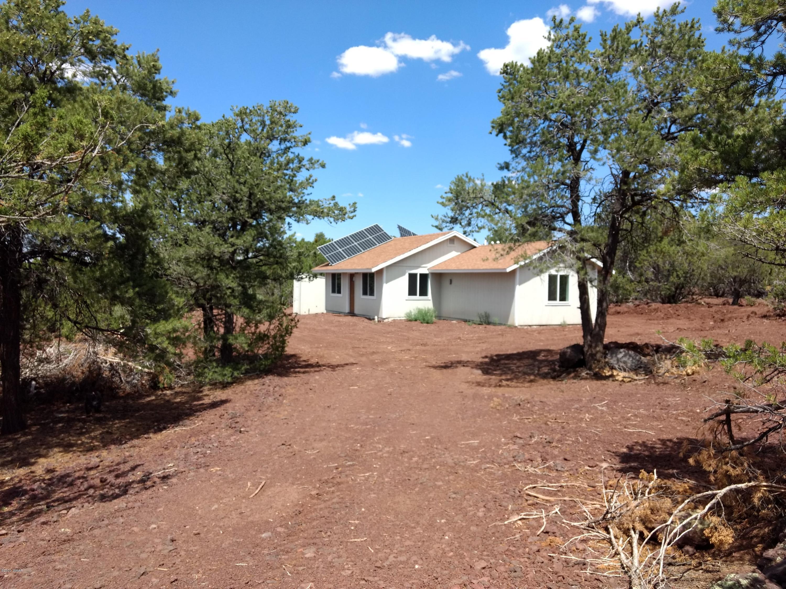 9 County Road Show Low, AZ 85901 - Photo 2 of 46 a view of house with outdoor space and trees