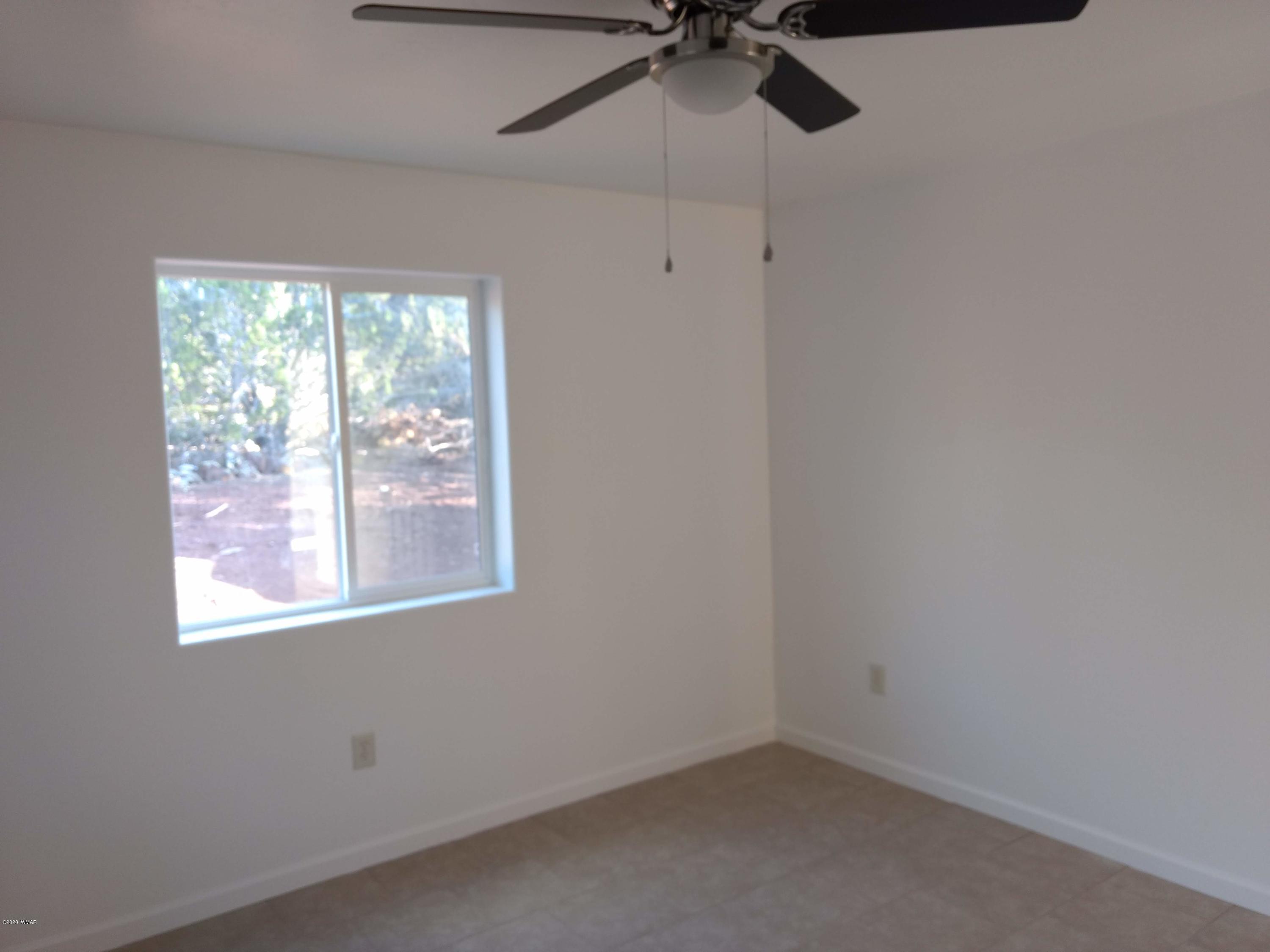 9 County Road Show Low, AZ 85901 - Photo 23 of 46 an empty room with a window