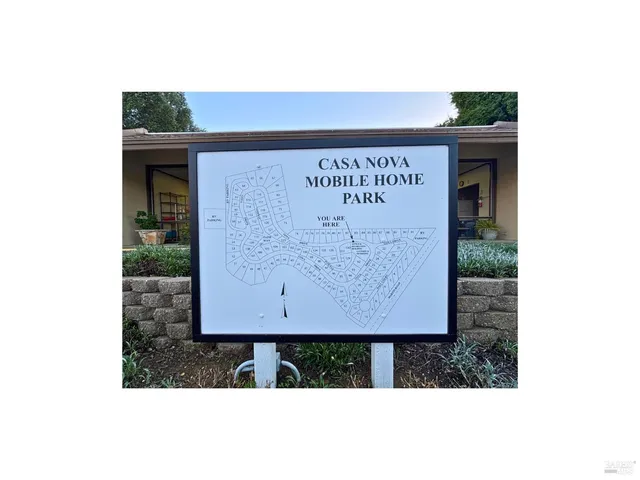 a picture of a bench in front of a building