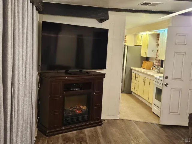 a kitchen with stainless steel appliances a stove and a microwave