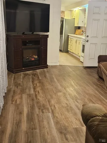 a view of a livingroom with furniture and a fireplace