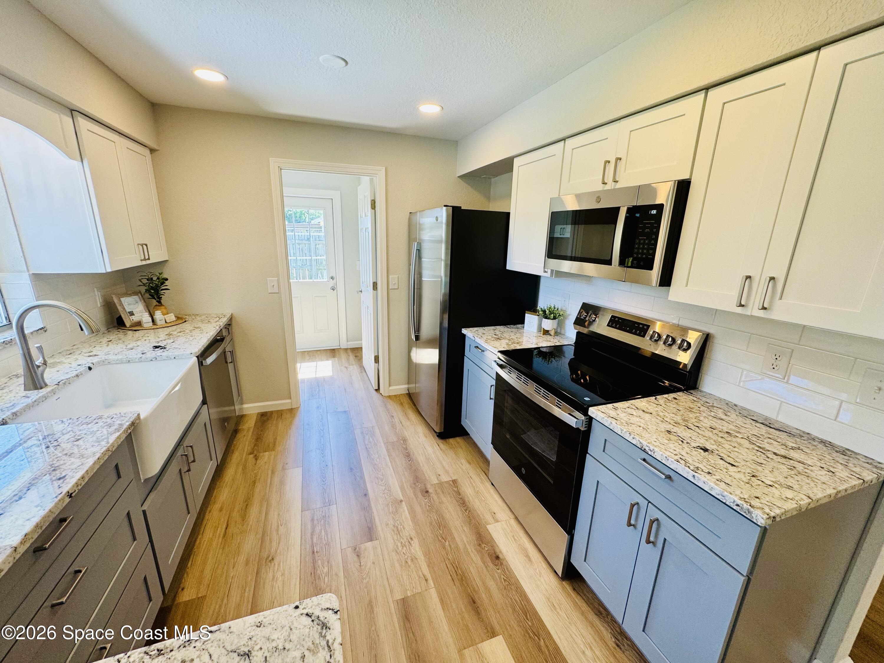 1910 Tallridge Road Melbourne, FL 32935 - Photo 9 of 34 Kitchen from Island