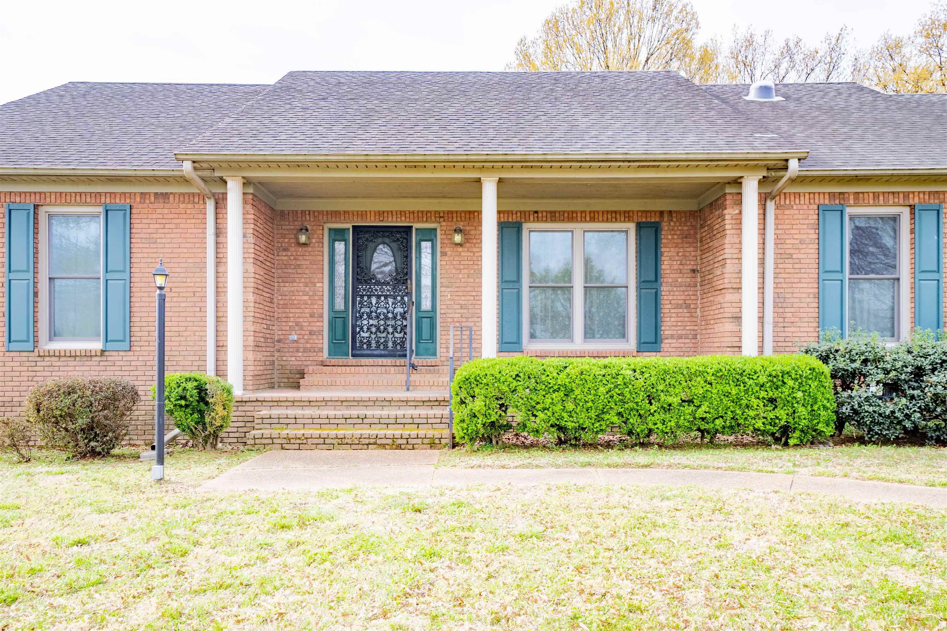 43 Hastings Way Covington, TN 38019 - Photo 2 of 21 a view of a house with a large window and plants