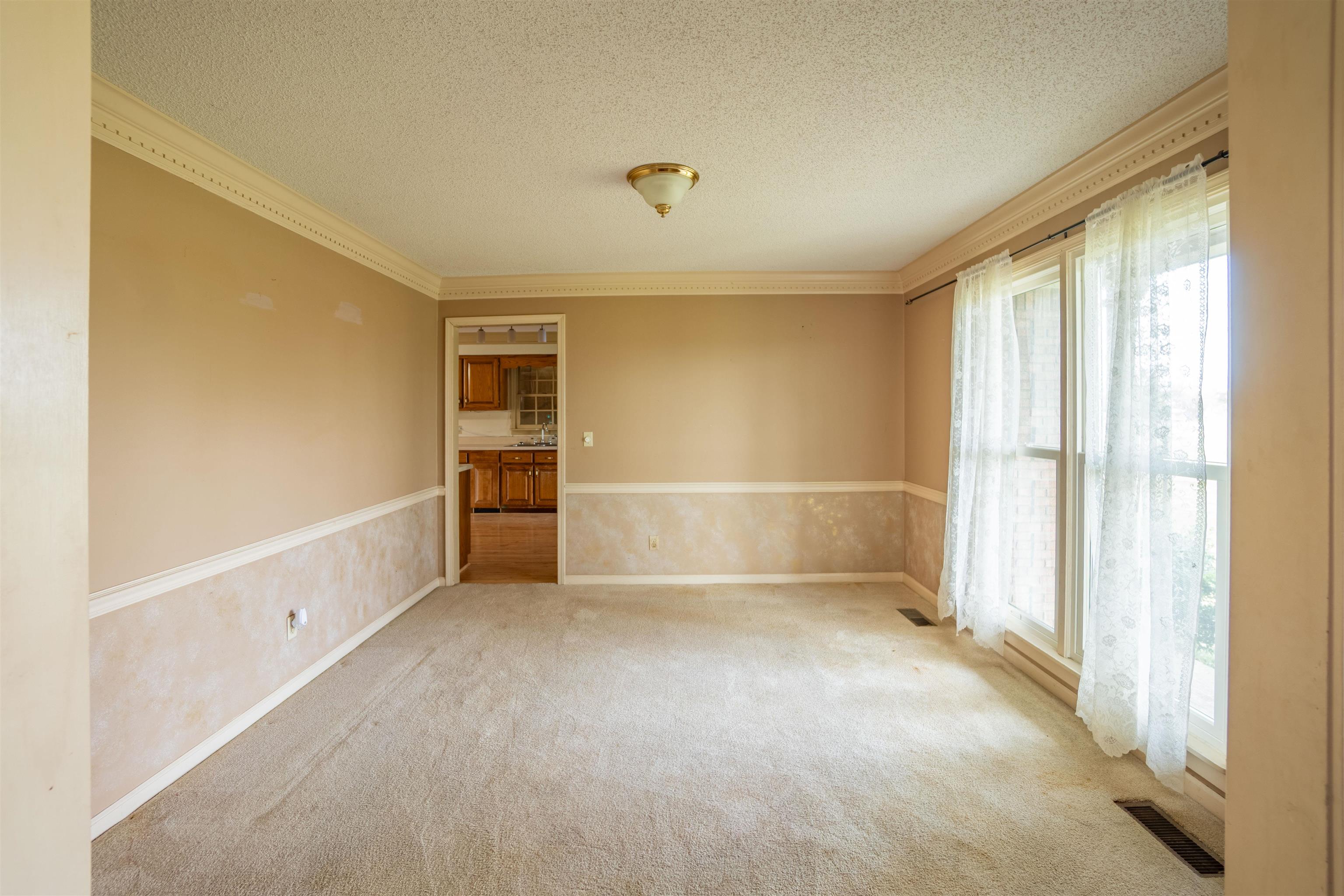 43 Hastings Way Covington, TN 38019 - Photo 7 of 21 a view of an empty room with a window