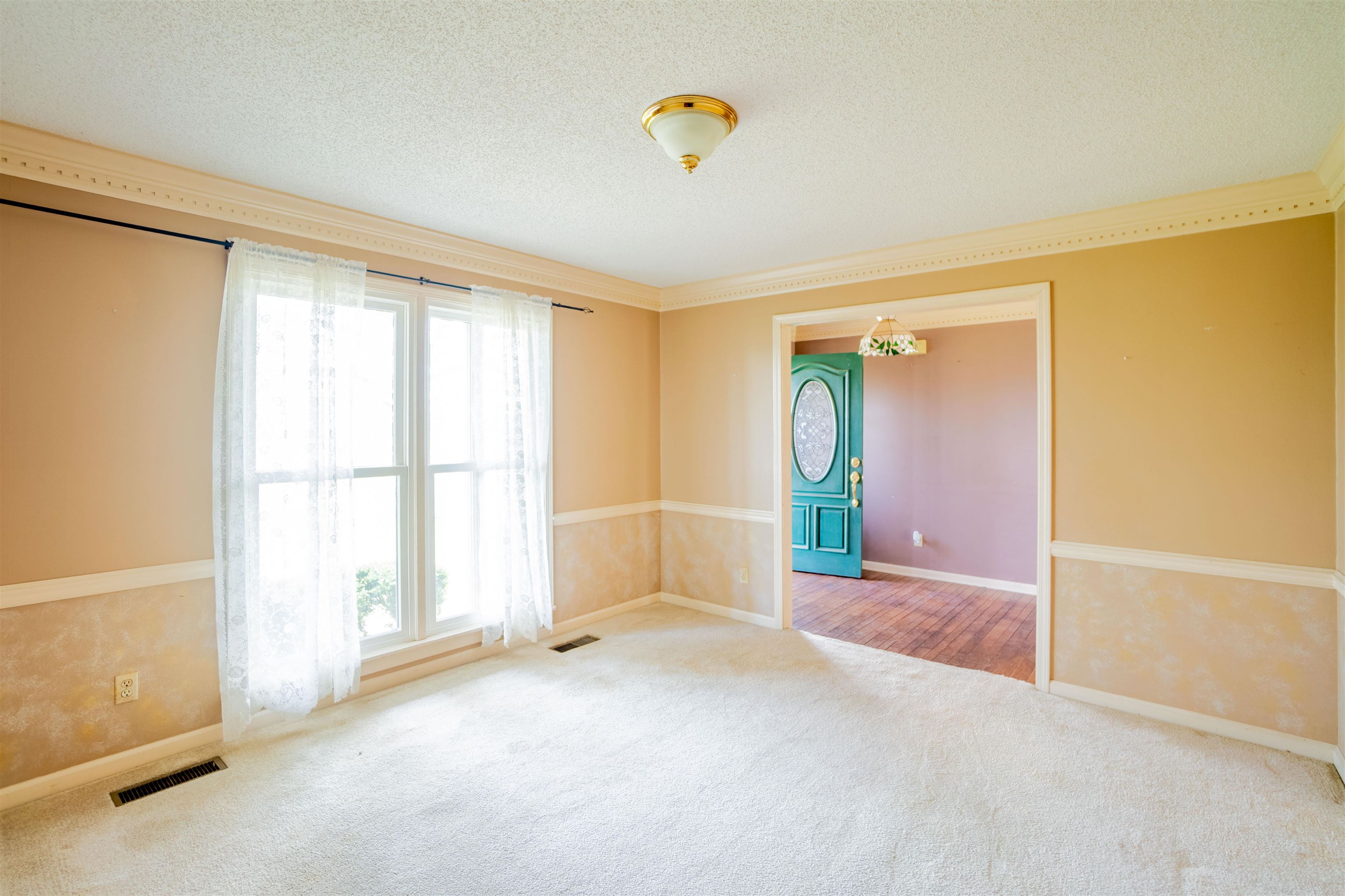 43 Hastings Way Covington, TN 38019 - Photo 8 of 21 wooden floor in an empty room with a window