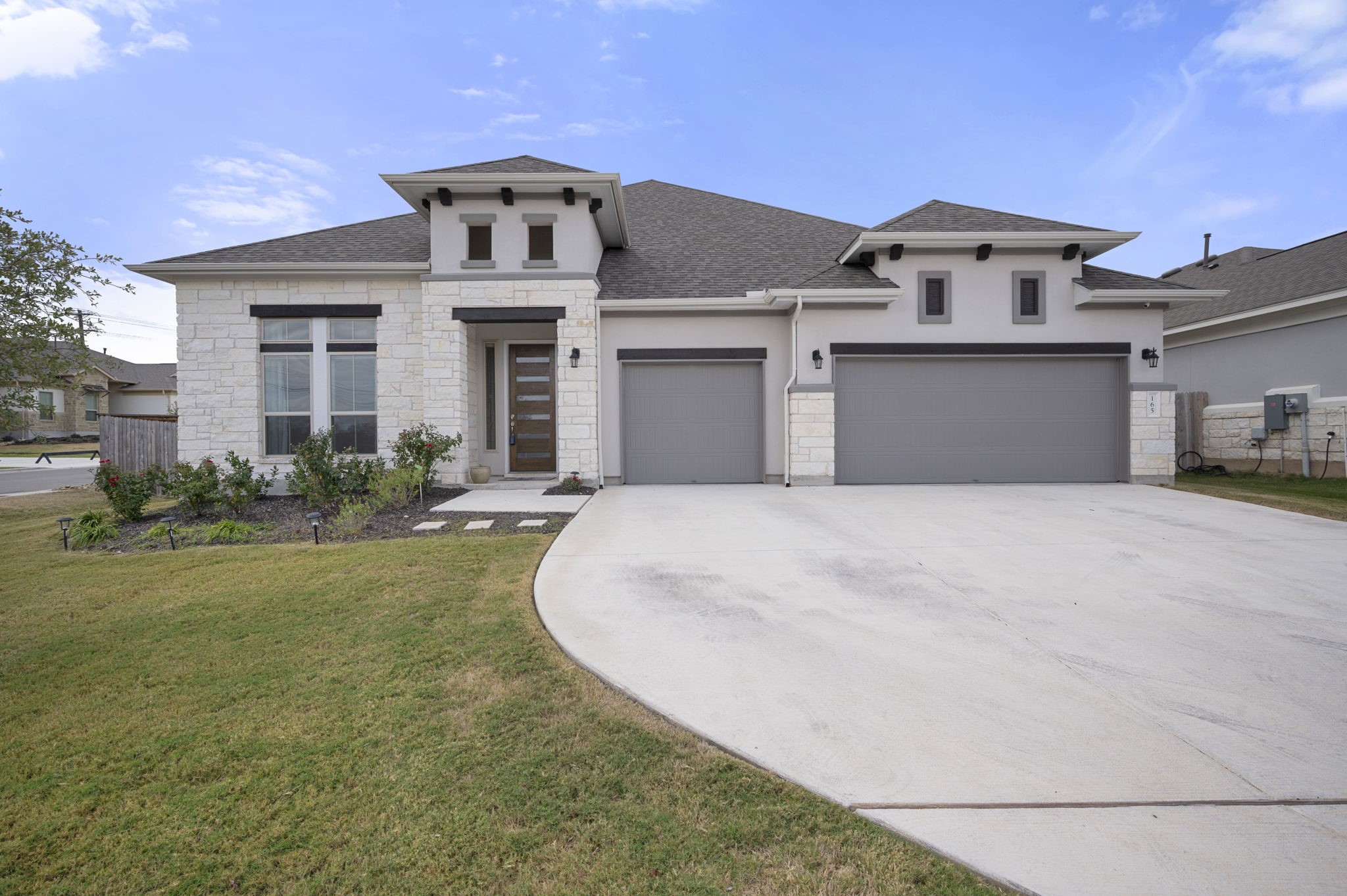 165 Eclipse Drive Austin, TX 78737 - Photo 1 of 38 a front view of a house with a yard