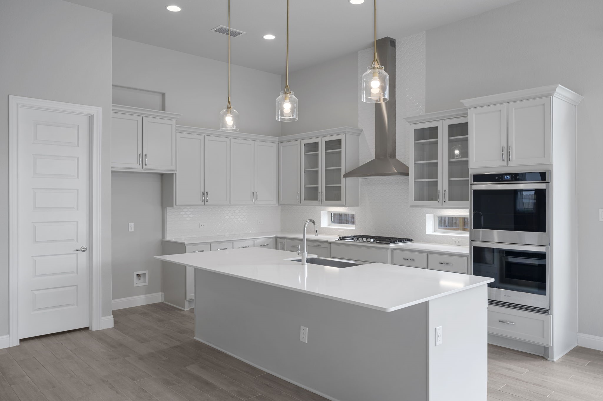 165 Eclipse Drive Austin, TX 78737 - Photo 13 of 38 a kitchen with kitchen island a sink stainless steel appliances and cabinets