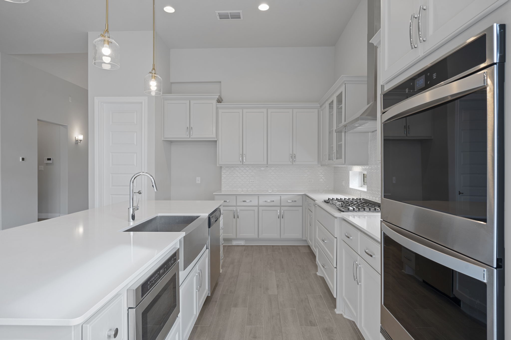 165 Eclipse Drive Austin, TX 78737 - Photo 14 of 38 a kitchen with granite countertop a sink stainless steel appliances and cabinets