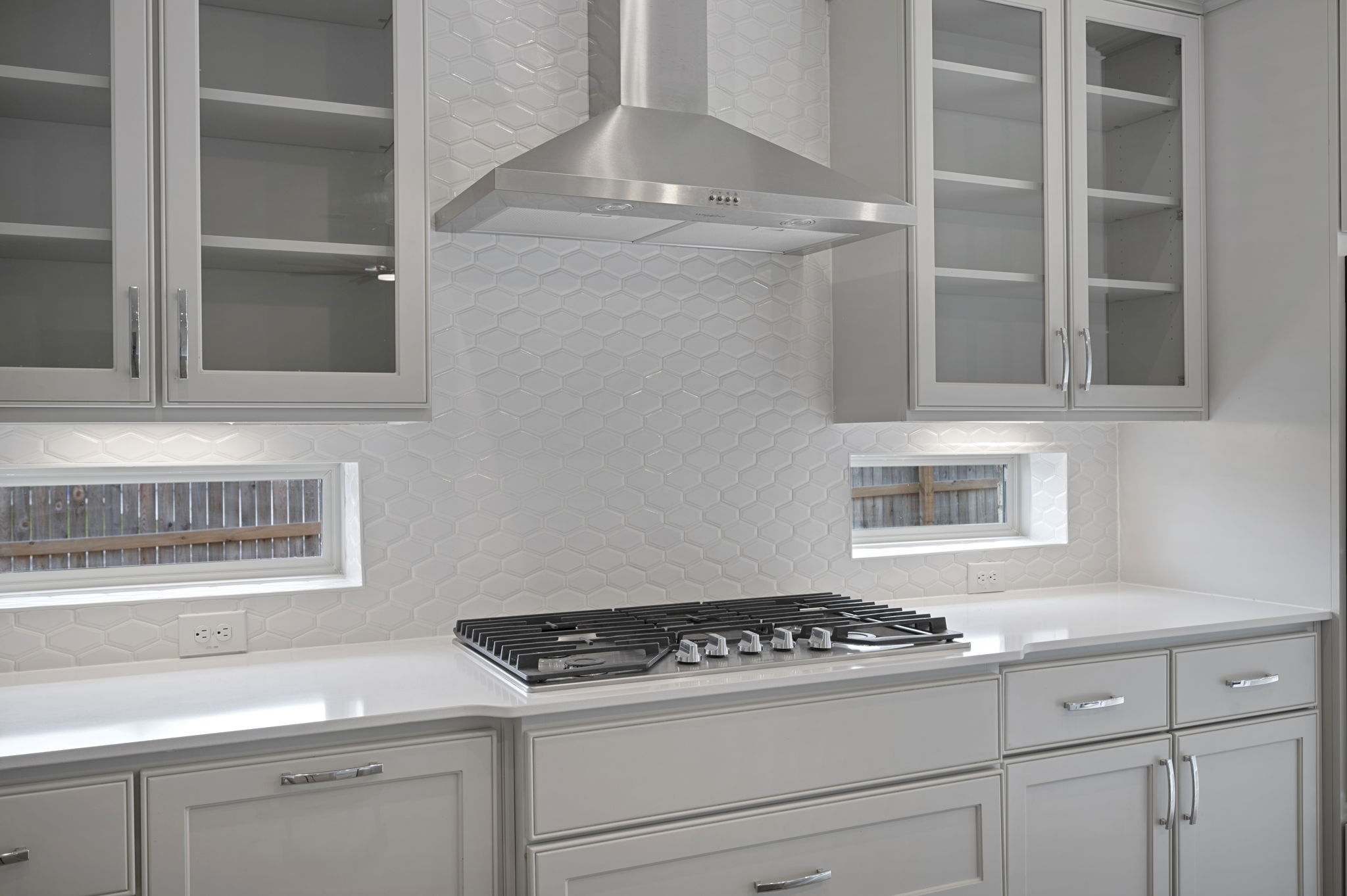 165 Eclipse Drive Austin, TX 78737 - Photo 16 of 38 a kitchen with granite countertop stainless steel appliances a stove and a white cabinet