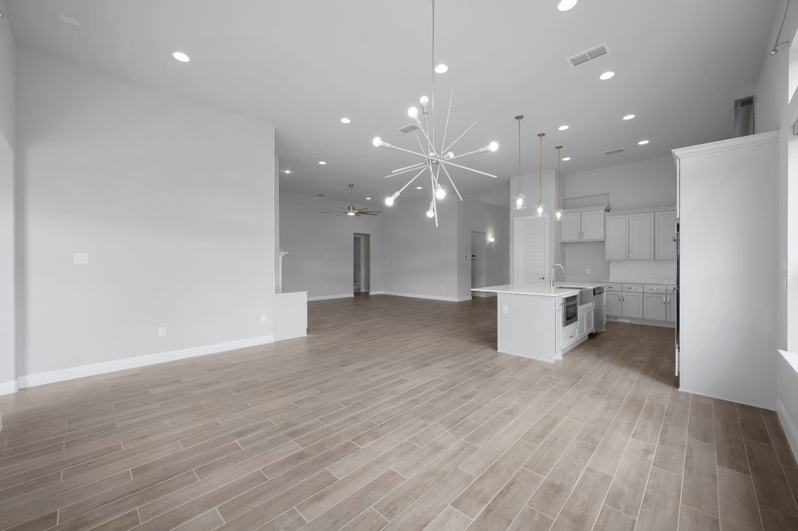 165 Eclipse Drive Austin, TX 78737 - Photo 19 of 38 a view of a kitchen with a sink and a refrigerator