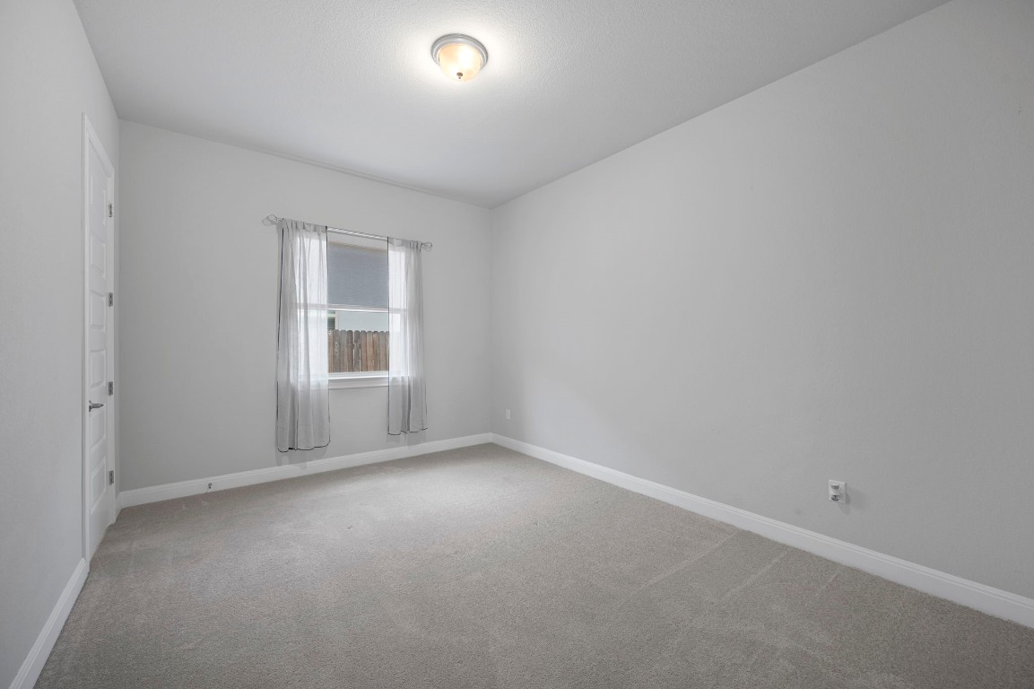 165 Eclipse Drive Austin, TX 78737 - Photo 25 of 38 an empty room with a window
