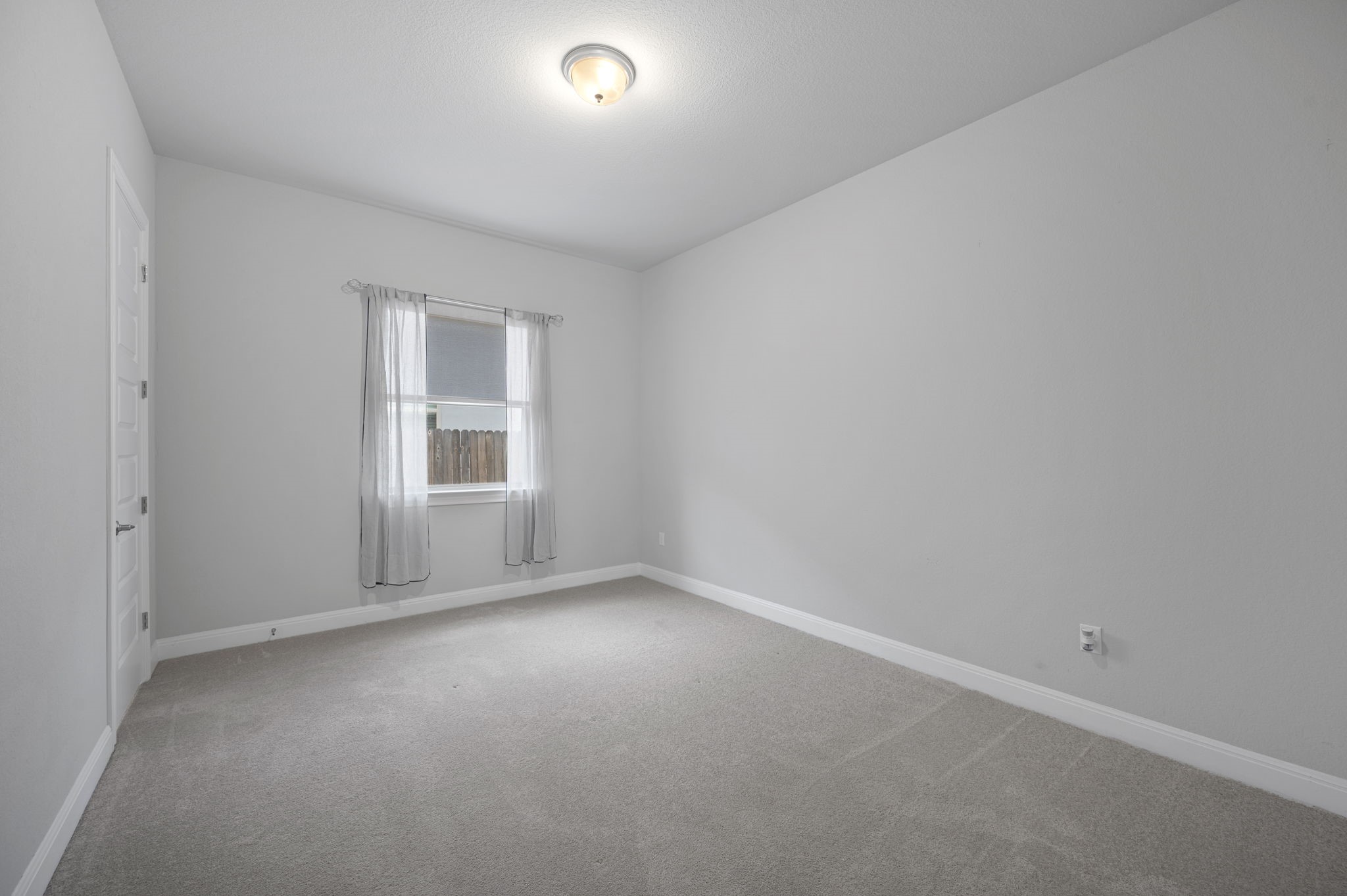 165 Eclipse Drive Austin, TX 78737 - Photo 25 of 38 an empty room with windows