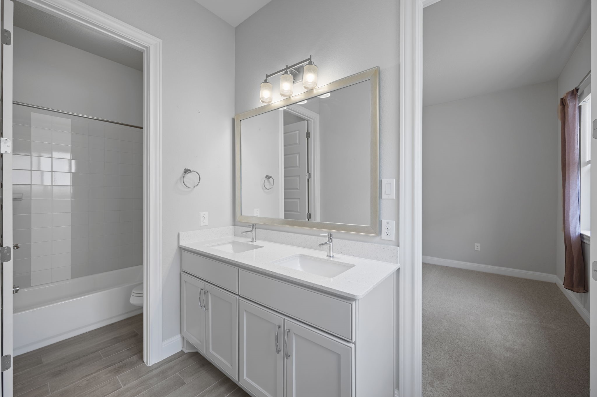 165 Eclipse Drive Austin, TX 78737 - Photo 27 of 38 a bathroom with a sink and a mirror