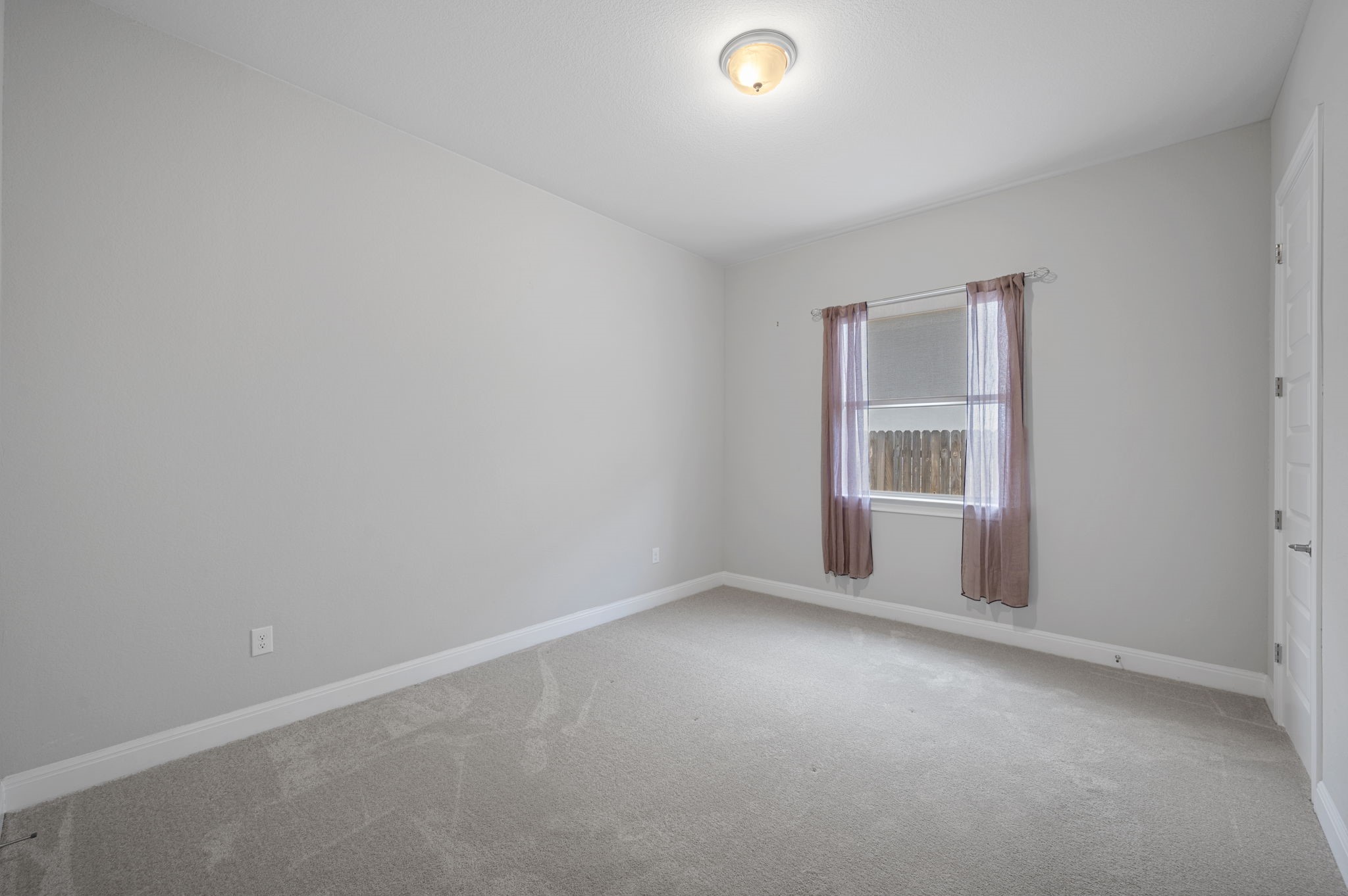 165 Eclipse Drive Austin, TX 78737 - Photo 28 of 38 a view of an empty room with a window