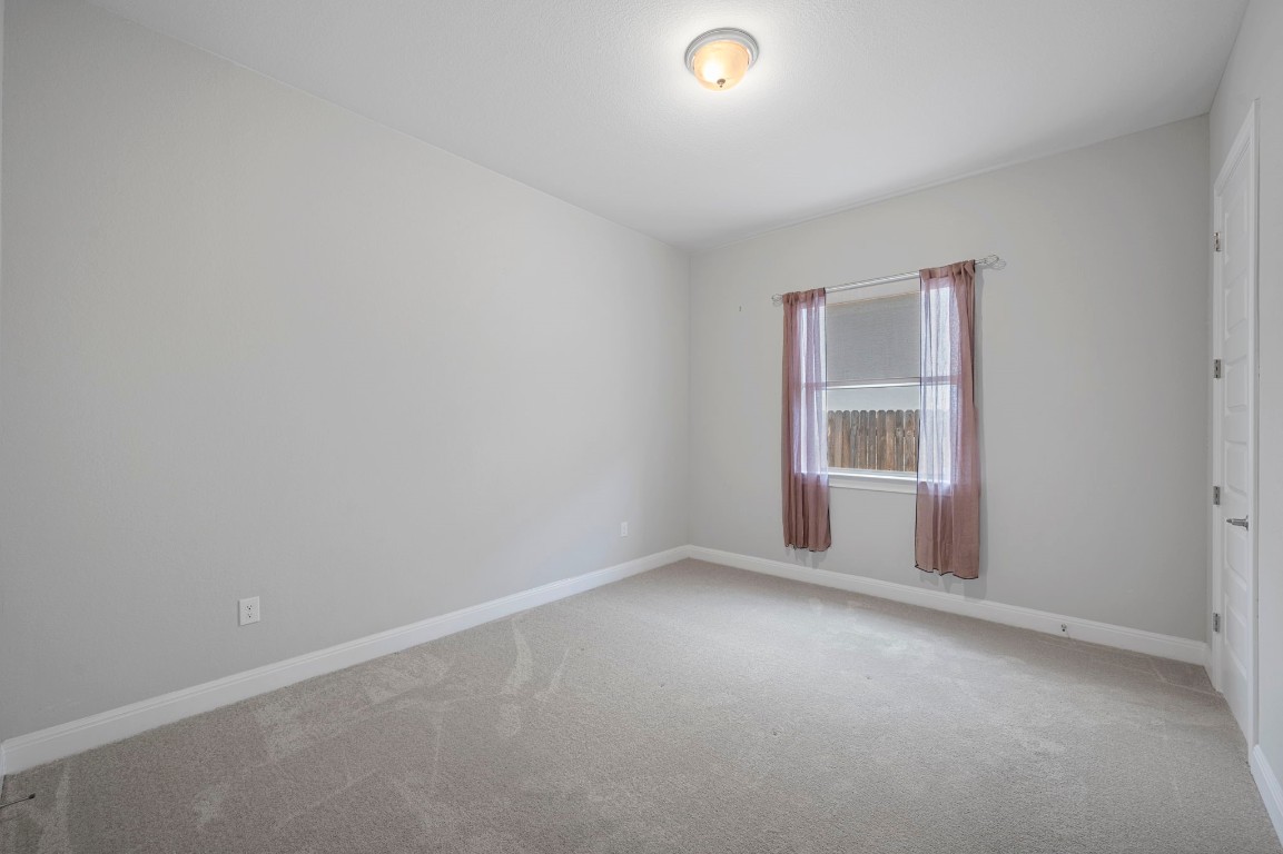 165 Eclipse Drive Austin, TX 78737 - Photo 28 of 38 a view of an empty room with a window