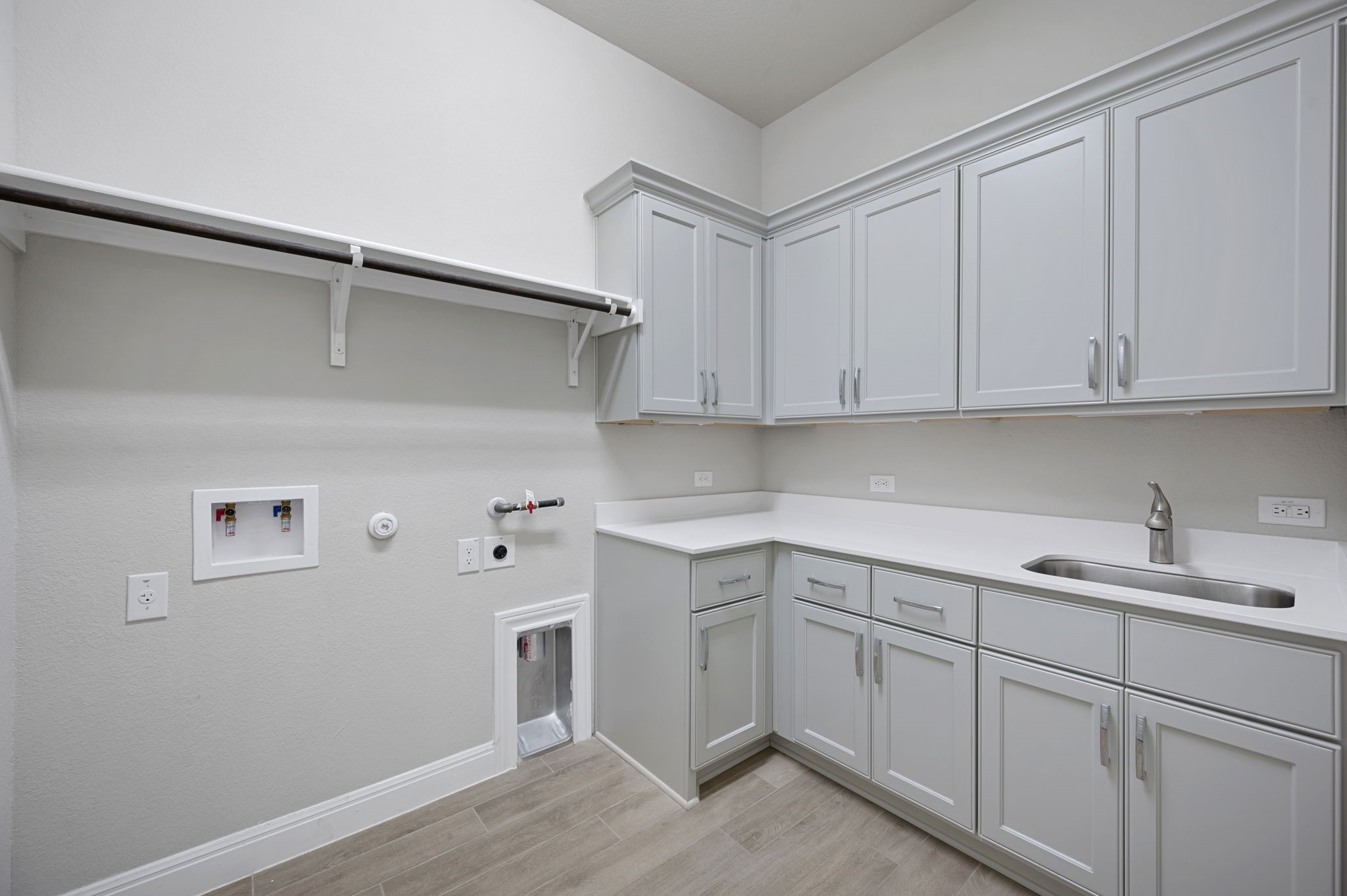 165 Eclipse Drive Austin, TX 78737 - Photo 31 of 38 a kitchen with a sink cabinets and wooden floor