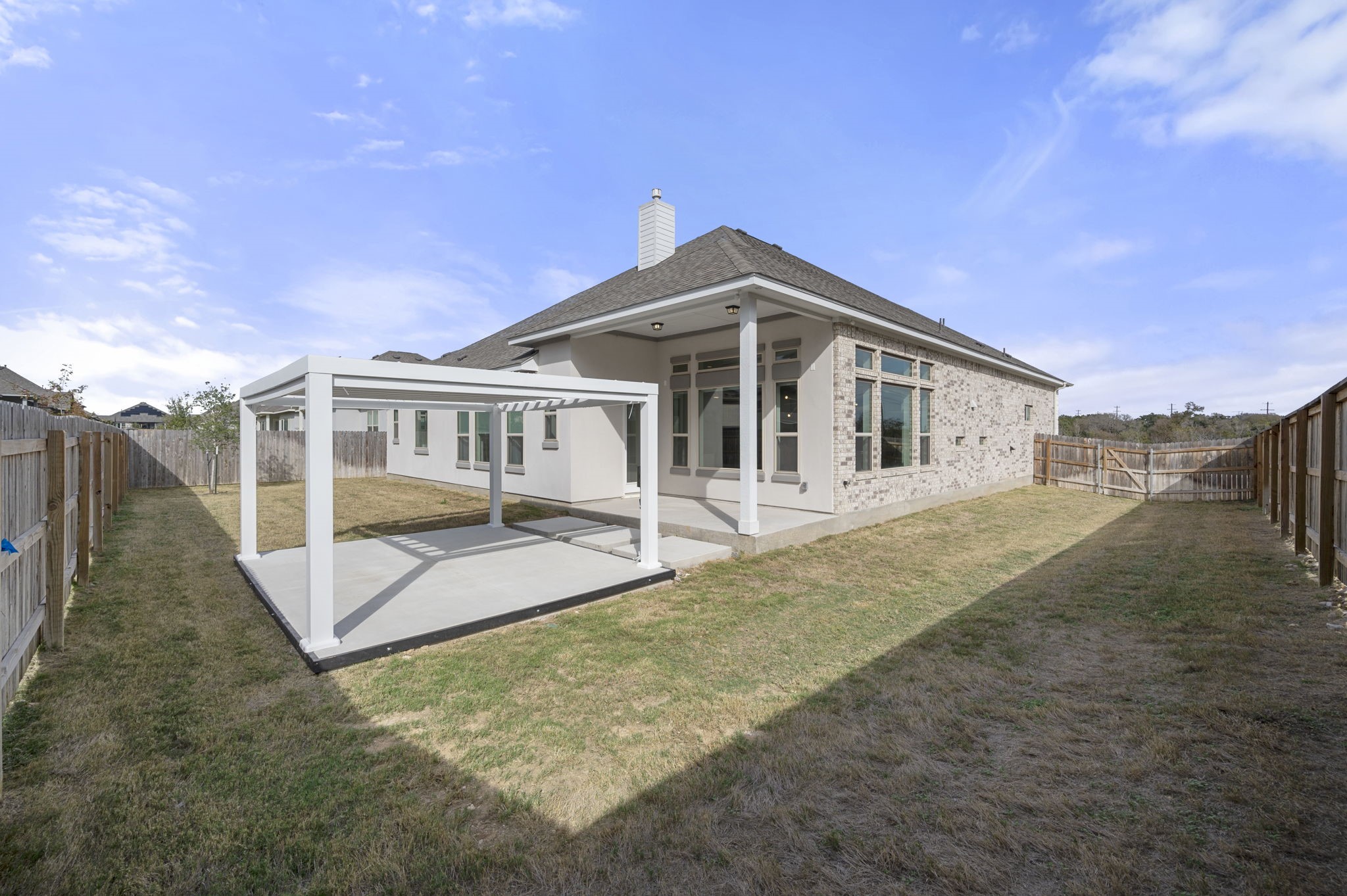 165 Eclipse Drive Austin, TX 78737 - Photo 34 of 38 a front view of a house with a yard