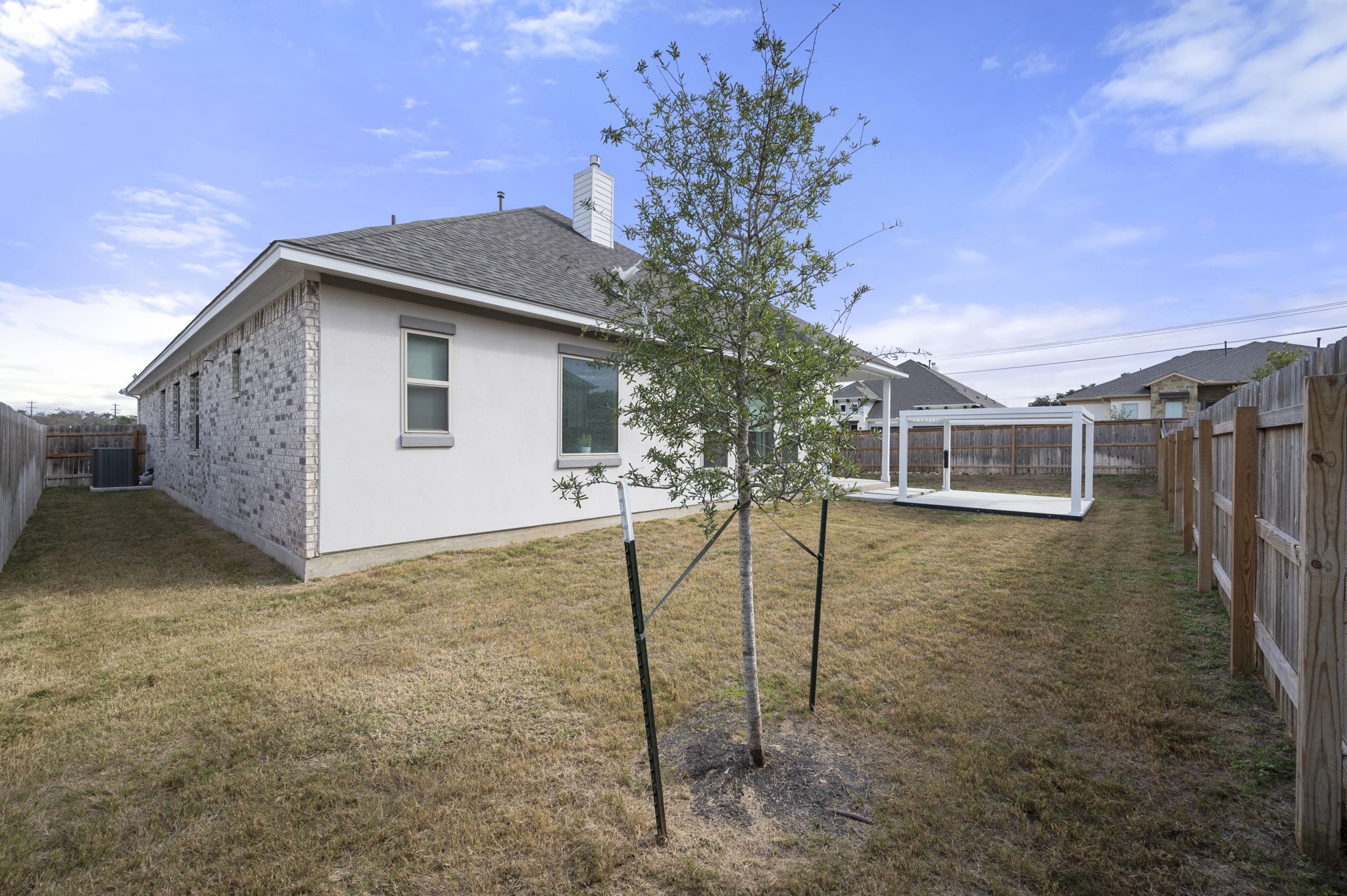 165 Eclipse Drive Austin, TX 78737 - Photo 36 of 38 a house view with a backyard space