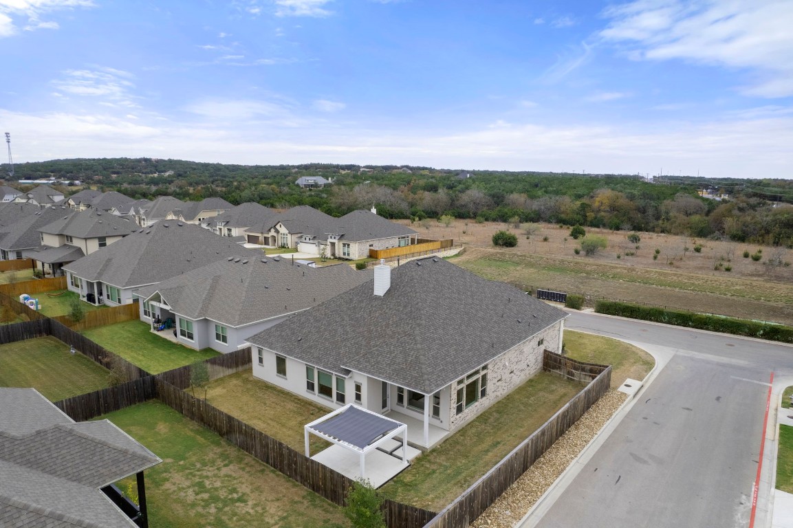 165 Eclipse Drive Austin, TX 78737 - Photo 37 of 38 an aerial view of residential houses with outdoor space and trees