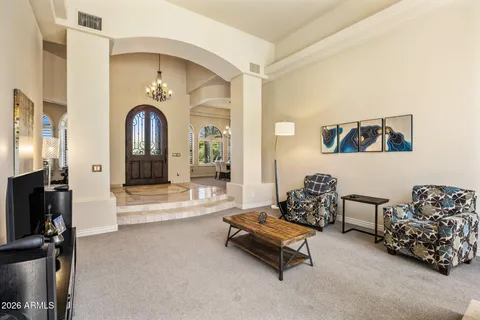 a living room with furniture gym equipment and a flat screen tv