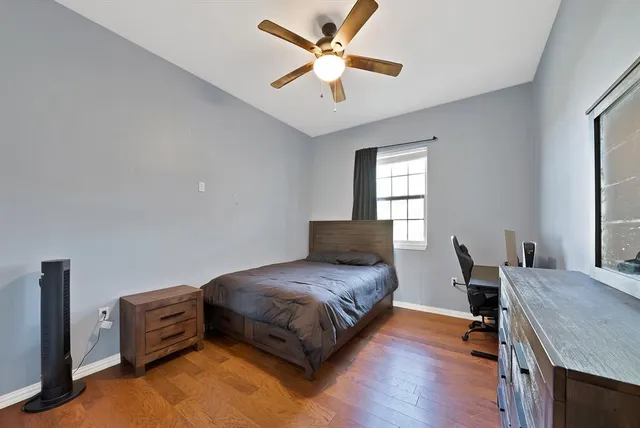 a bedroom with a bed and a couch