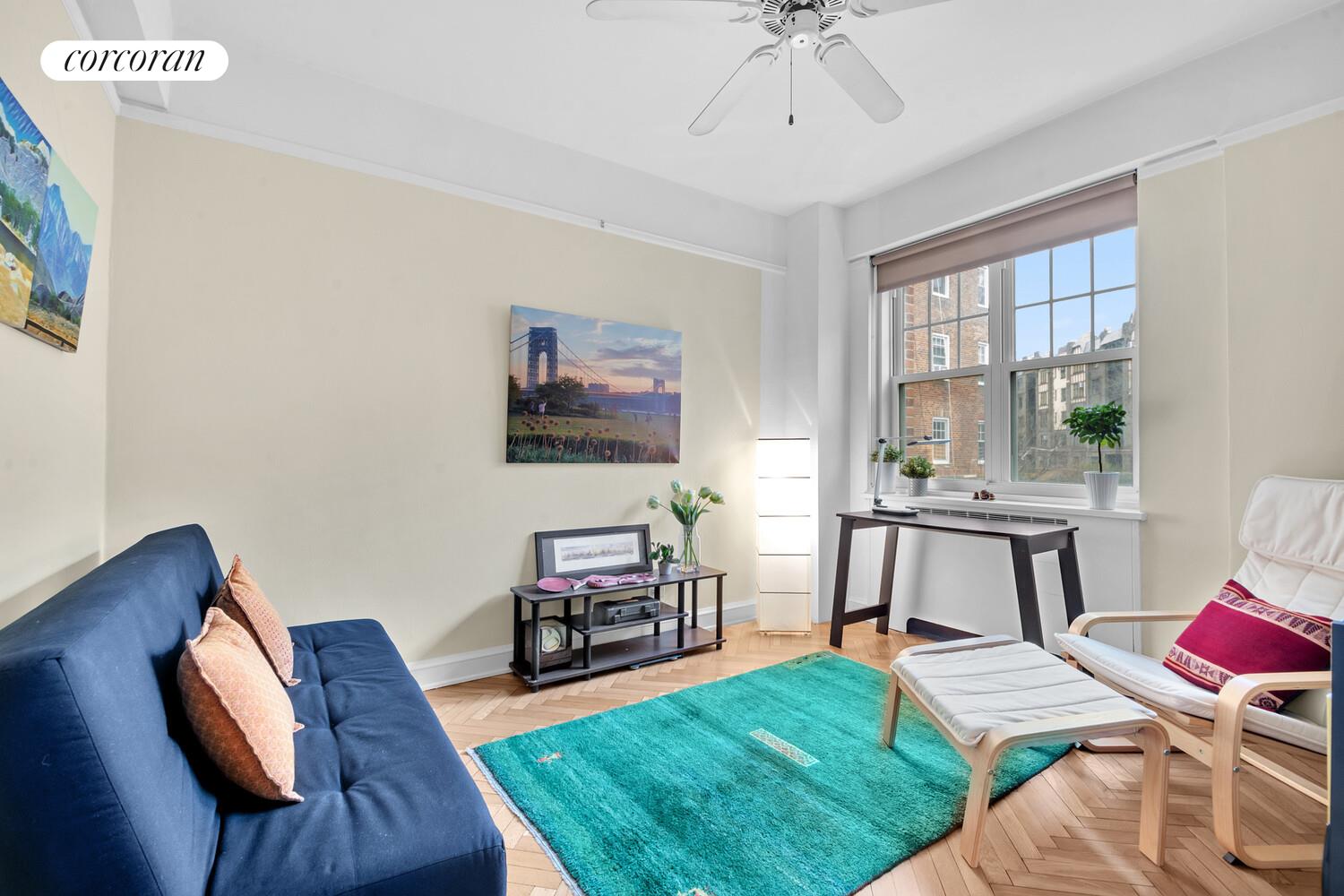 120 Cabrini Boulevard, Unit 44 Manhattan, NY 10033 - Photo 11 of 21 a living room with furniture and a wooden floor