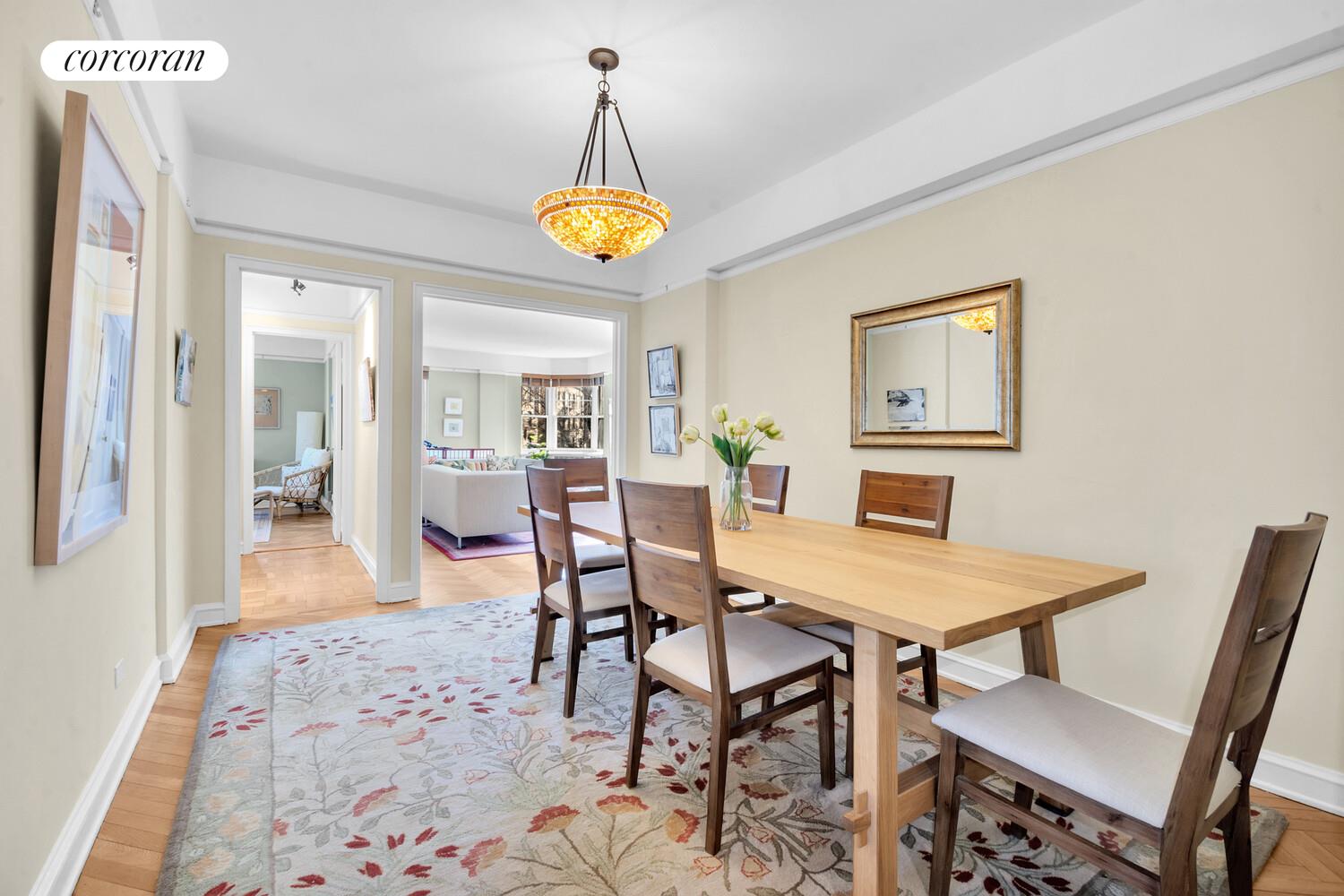 120 Cabrini Boulevard, Unit 44 Manhattan, NY 10033 - Photo 7 of 21 a view of a dining room with furniture and wooden floor