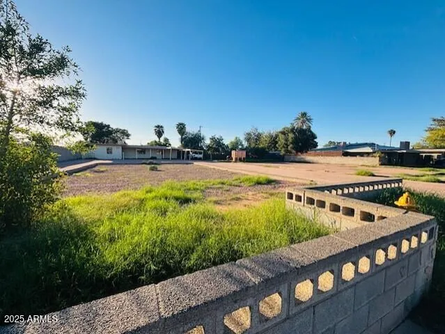 a view of a swimming pool with an outdoor seating and a garden