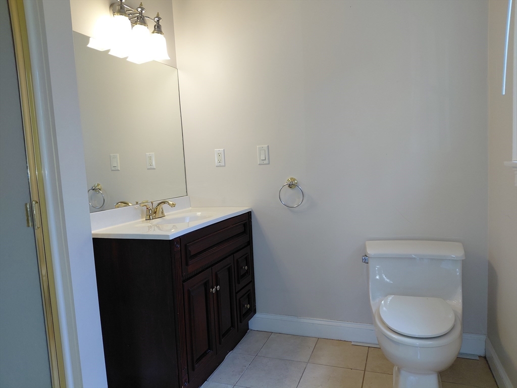 218 Lowell Street Lexington, MA 02420 - Photo 20 of 42 a bathroom with a sink and a toilet
