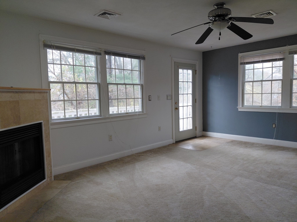218 Lowell Street Lexington, MA 02420 - Photo 25 of 42 a view of an empty room with a window