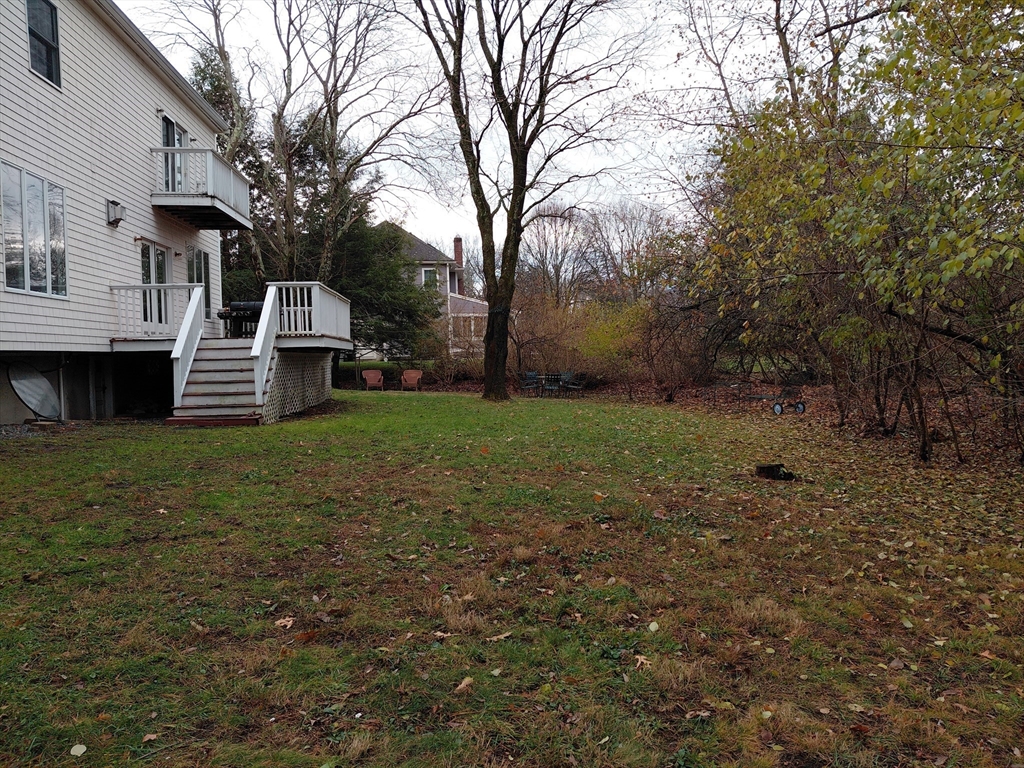 218 Lowell Street Lexington, MA 02420 - Photo 7 of 42 a view of a house with a yard