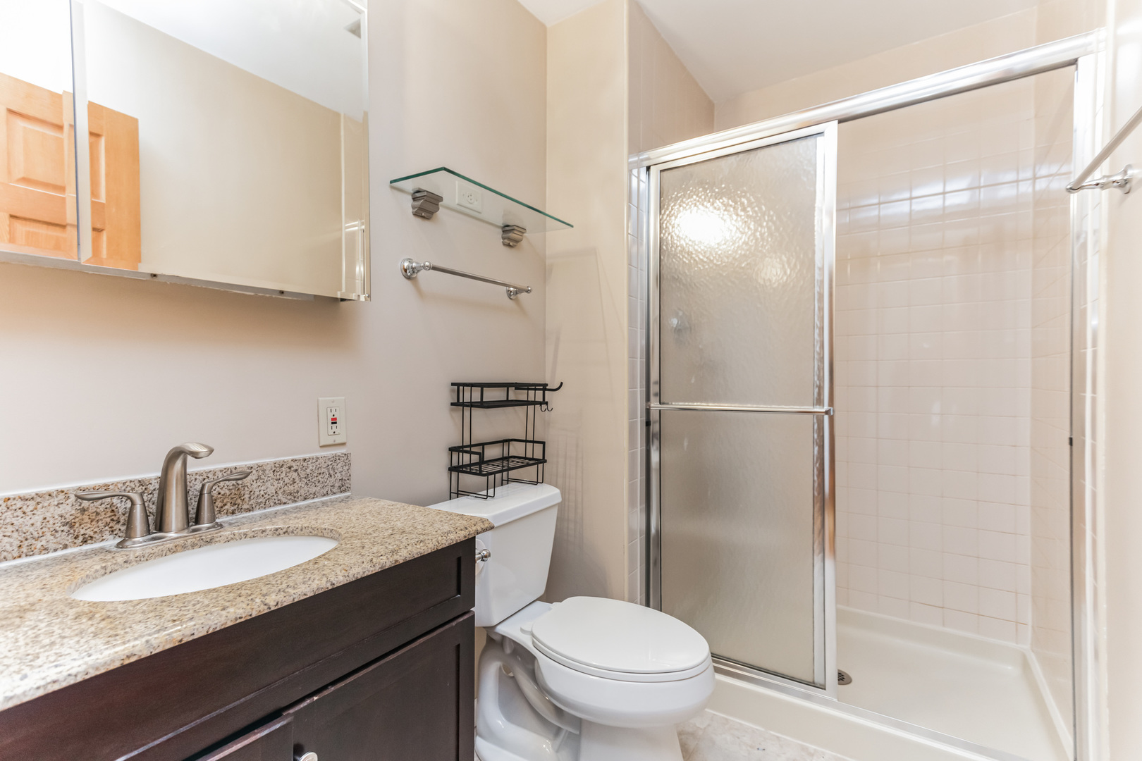 508 North Walnut Lane Schaumburg, IL 60107 - Photo 14 of 25 a bathroom with a granite countertop sink toilet and shower