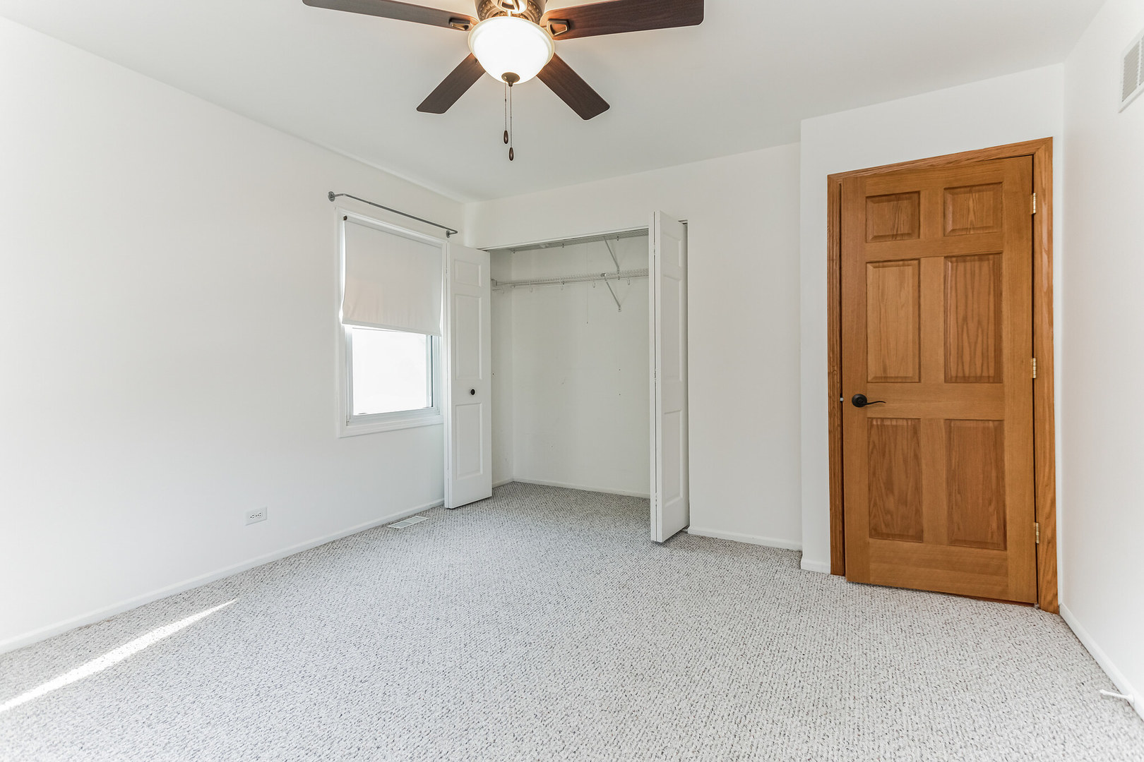 508 North Walnut Lane Schaumburg, IL 60107 - Photo 20 of 25 an empty room with chandelier fan