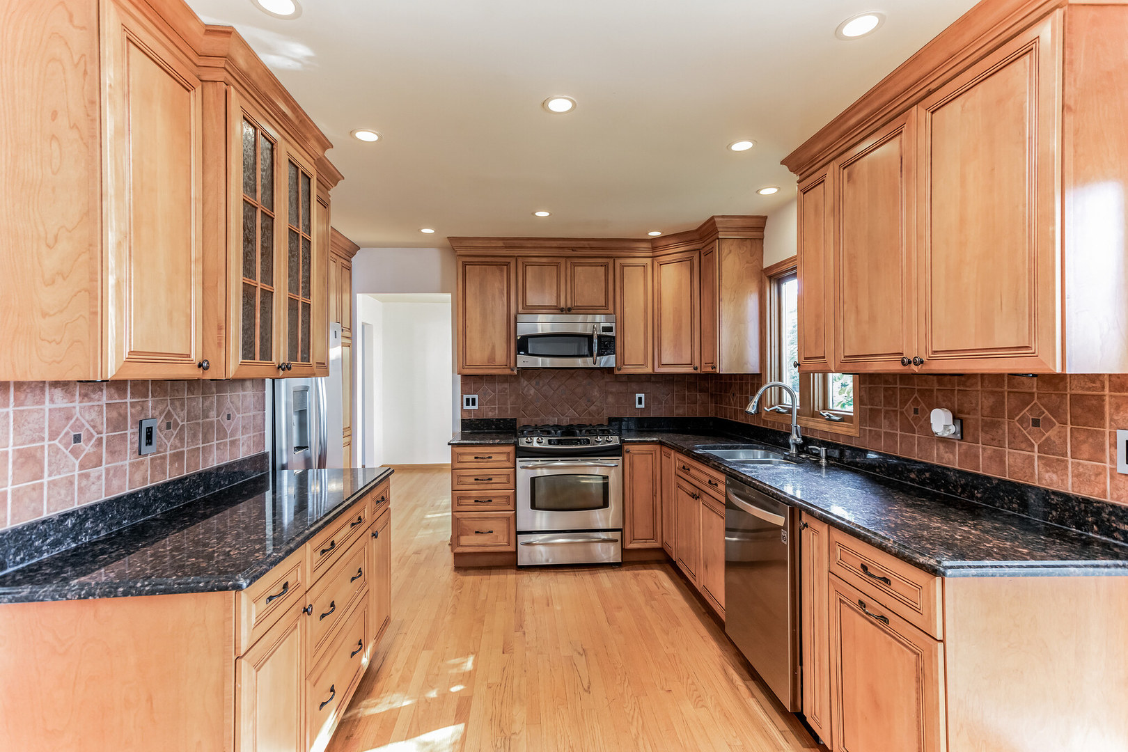 508 North Walnut Lane Schaumburg, IL 60107 - Photo 8 of 25 a kitchen with stainless steel appliances granite countertop a stove a sink and a granite counter tops