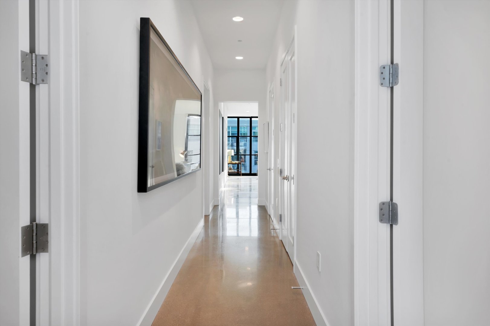 900 West Washington Boulevard, Unit 701 Chicago, IL 60607 - Photo 19 of 24 a view of a hallway with wooden floor and closet