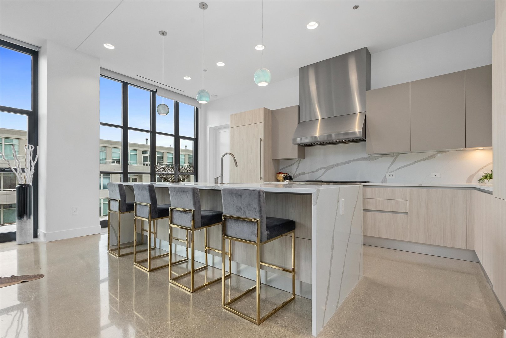 900 West Washington Boulevard, Unit 701 Chicago, IL 60607 - Photo 3 of 24 a kitchen with stainless steel appliances granite countertop a stove and white cabinets