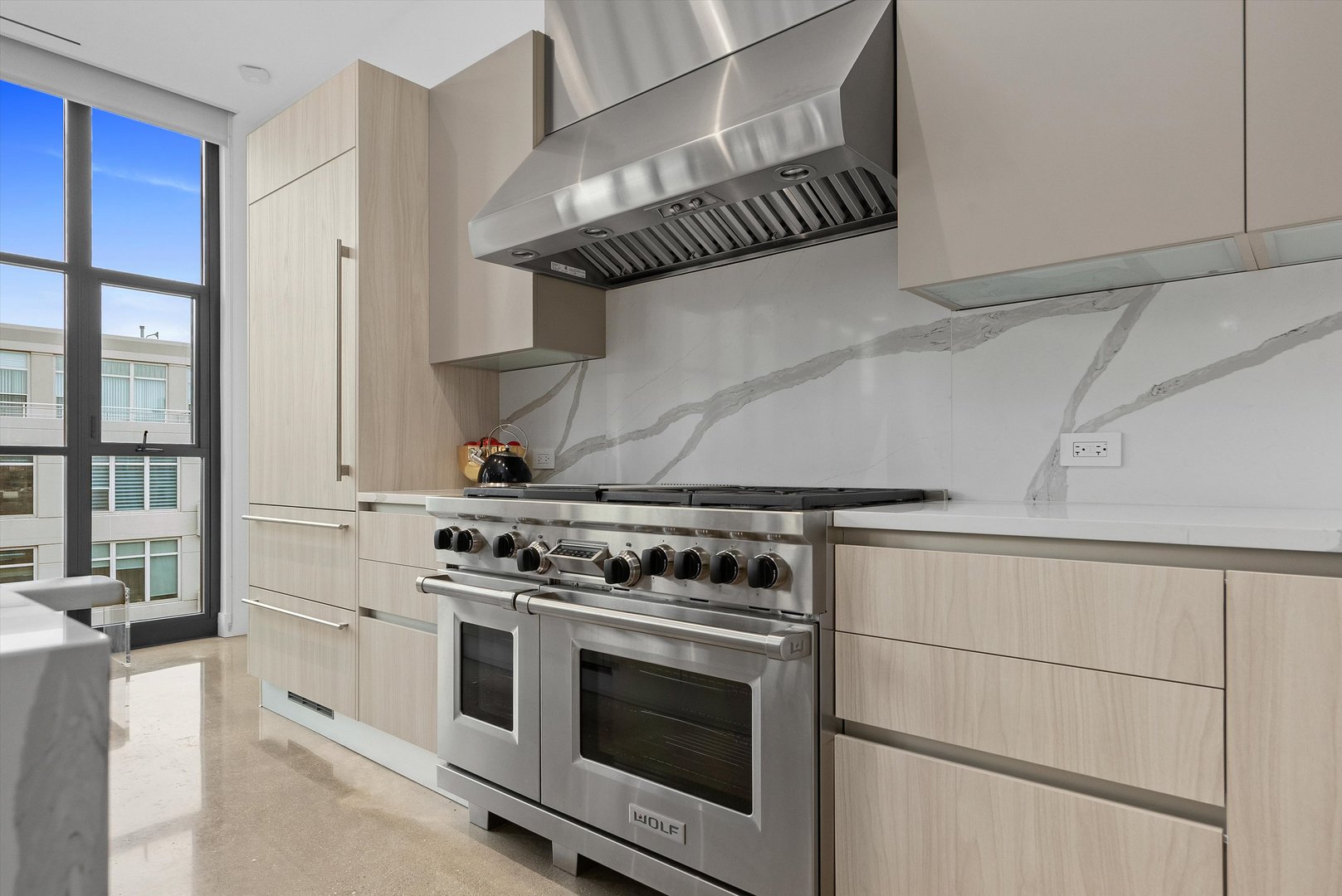 900 West Washington Boulevard, Unit 701 Chicago, IL 60607 - Photo 4 of 24 a white stove top oven sitting inside of a kitchen
