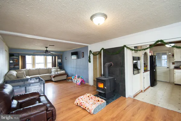 a living room with furniture fireplace and a table