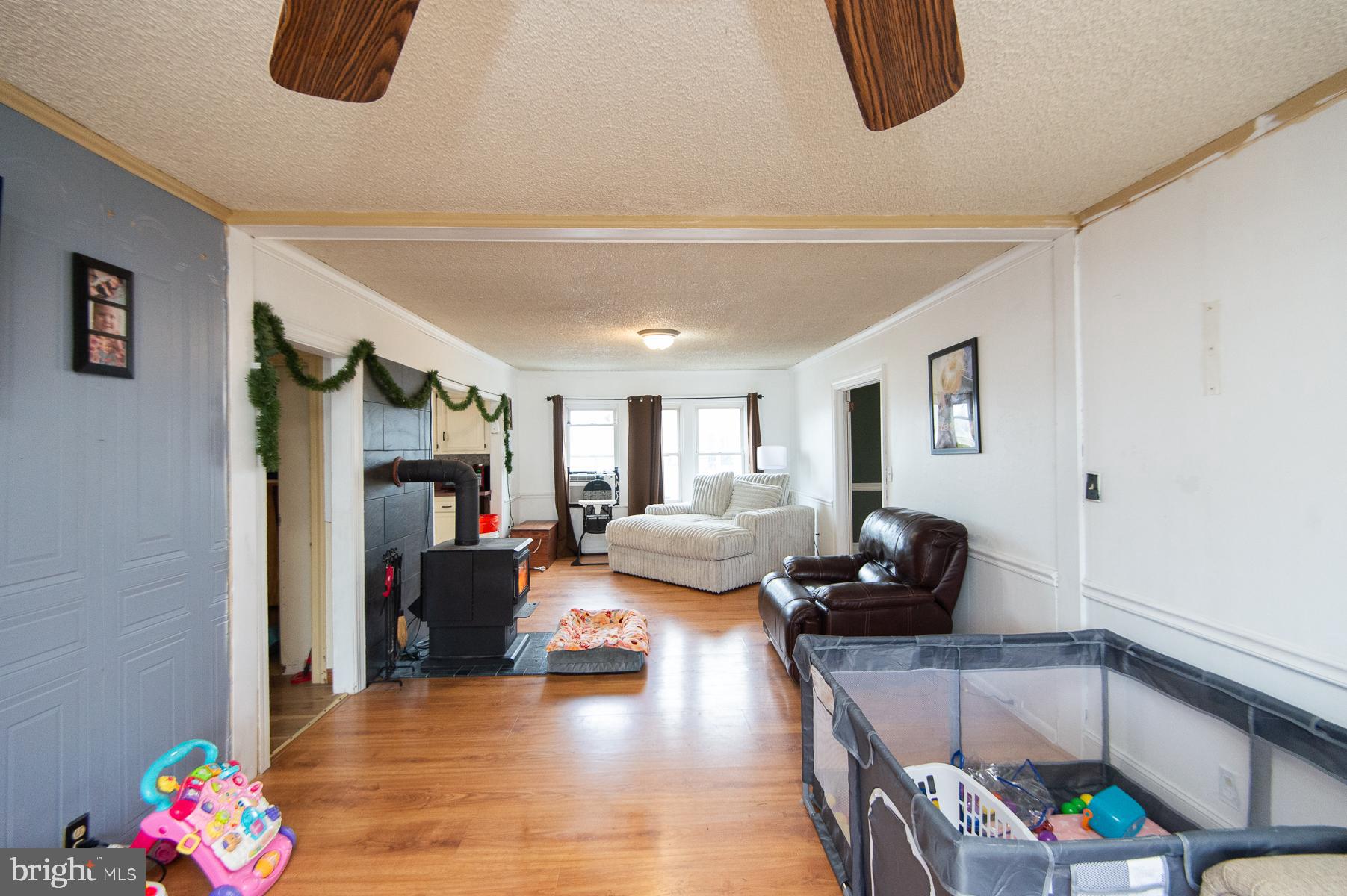 2537 Old House Point Road Fishing Creek, MD 21634 - Photo 16 of 37 a living room with furniture and a flat screen tv
