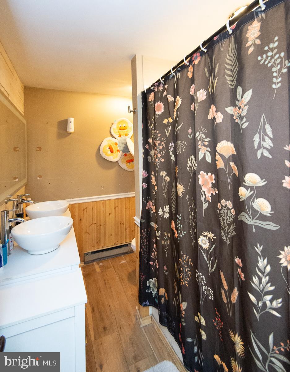 2537 Old House Point Road Fishing Creek, MD 21634 - Photo 17 of 37 a bathroom with a sink and a mirror