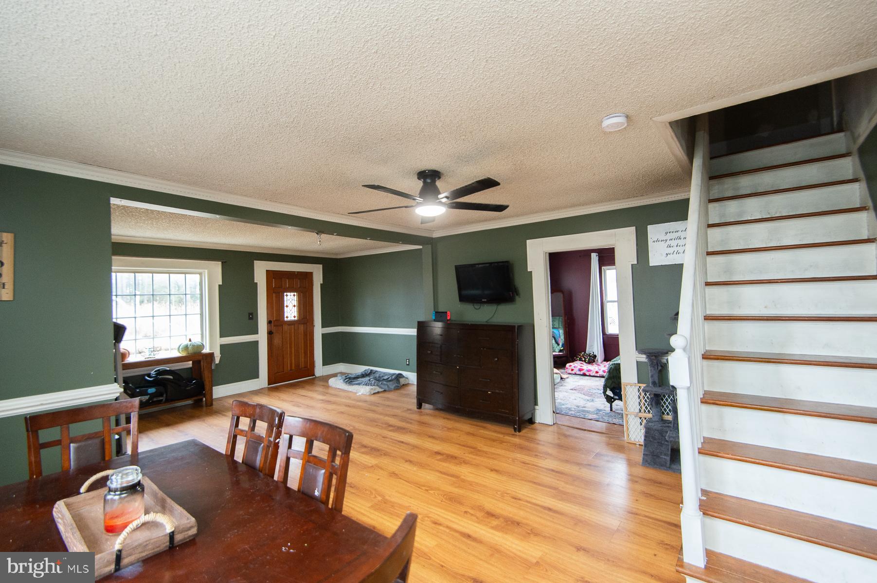 2537 Old House Point Road Fishing Creek, MD 21634 - Photo 19 of 37 a living room with furniture window and wooden floor