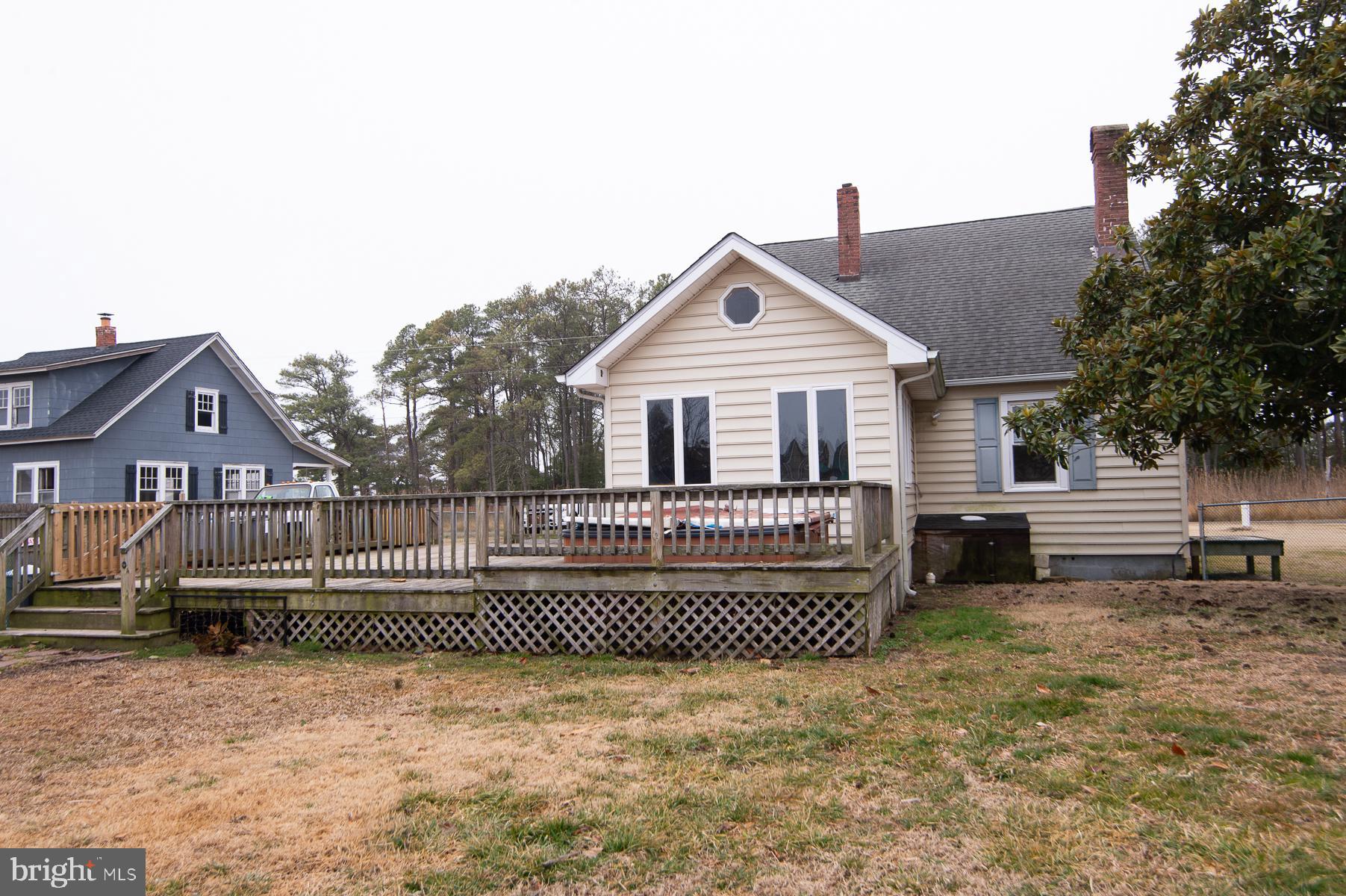 2537 Old House Point Road Fishing Creek, MD 21634 - Photo 2 of 37 a front view of a house with a yard