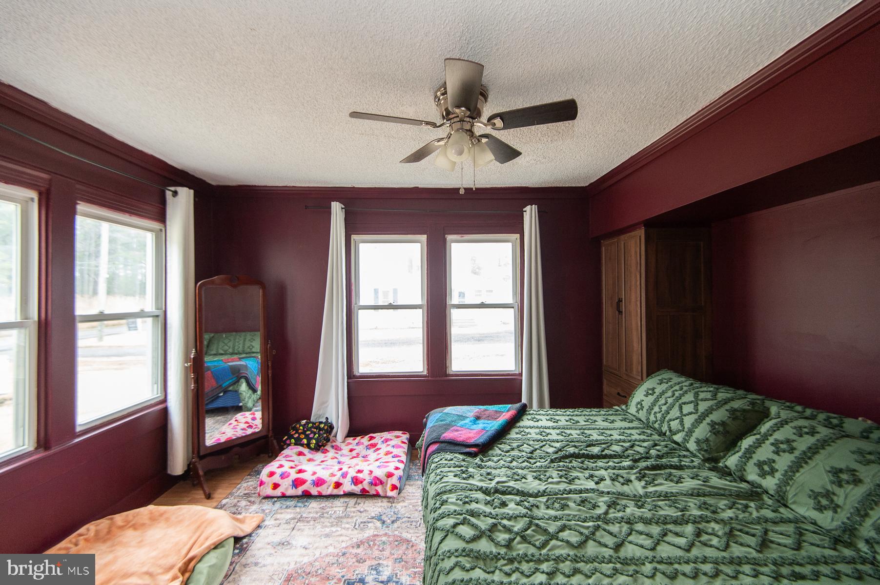 2537 Old House Point Road Fishing Creek, MD 21634 - Photo 24 of 37 a bedroom with bed and a window