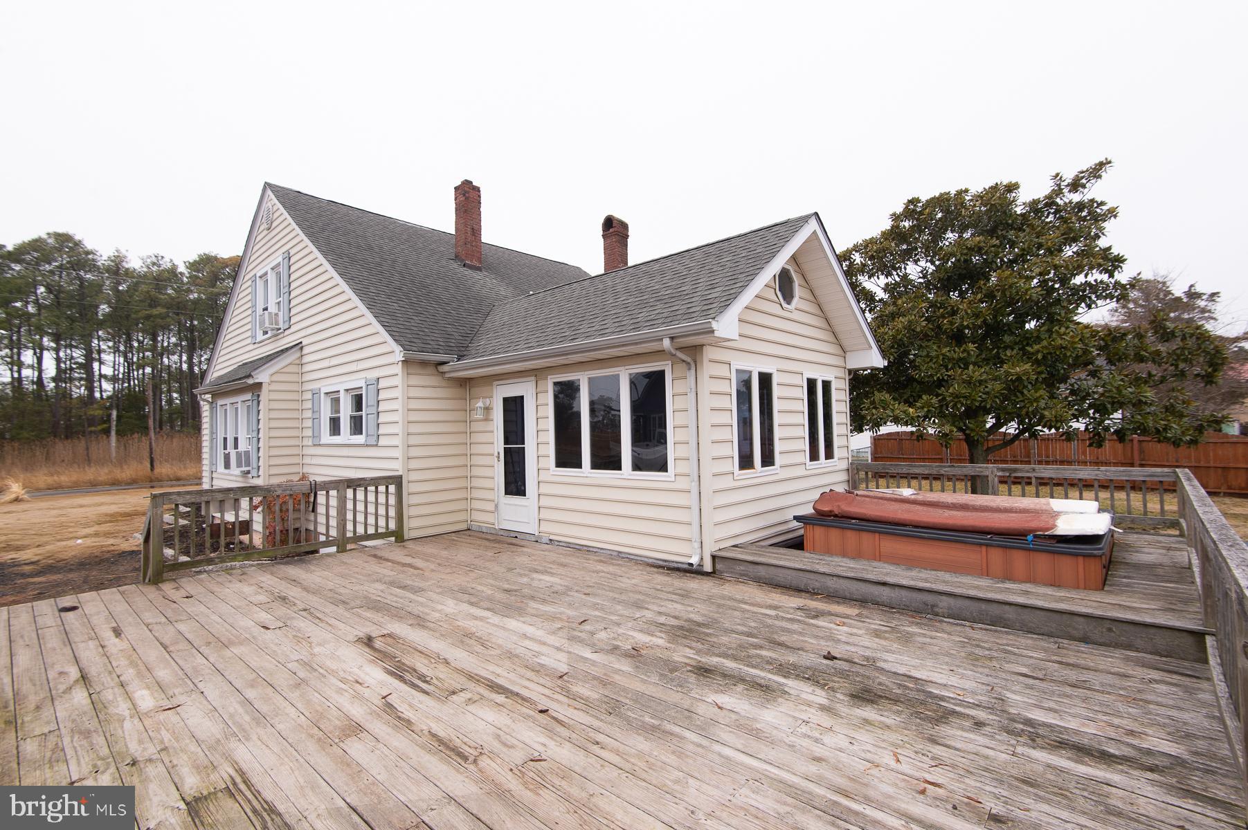 2537 Old House Point Road Fishing Creek, MD 21634 - Photo 3 of 37 a front view of house with deck and yard