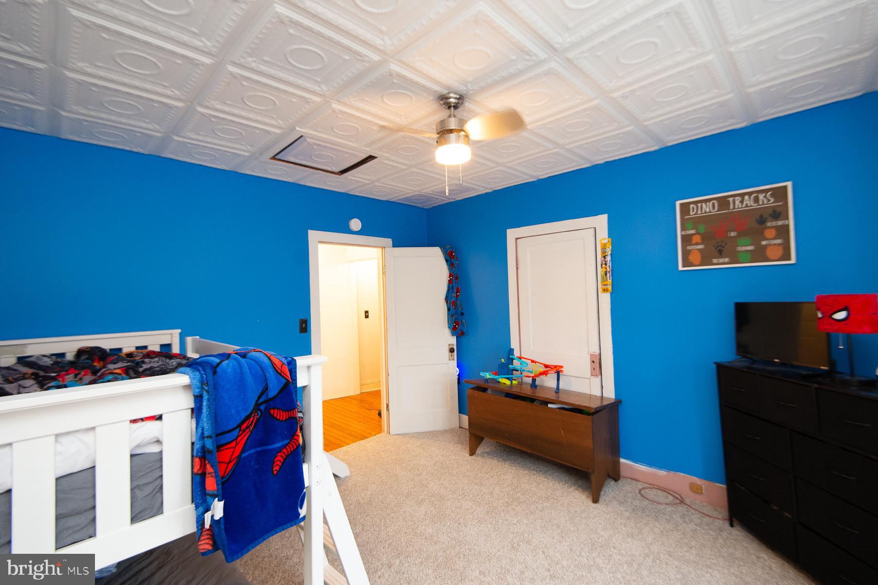 2537 Old House Point Road Fishing Creek, MD 21634 - Photo 32 of 37 a bedroom with furniture and a fan