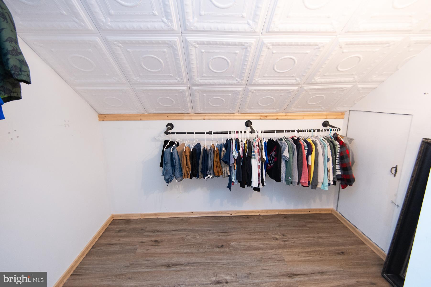 2537 Old House Point Road Fishing Creek, MD 21634 - Photo 34 of 37 a view of walk in closet with clothes and shoes
