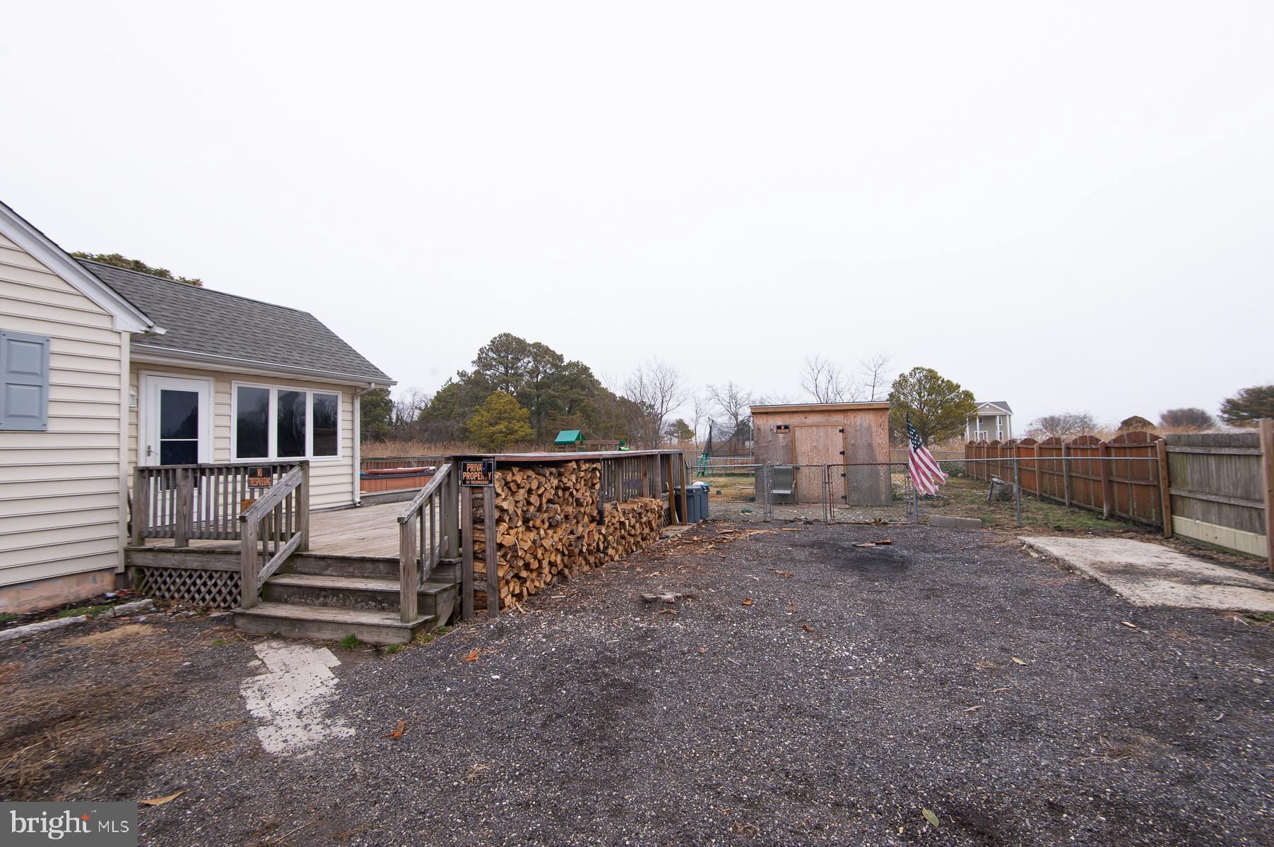 2537 Old House Point Road Fishing Creek, MD 21634 - Photo 4 of 37 a view of a house with a yard
