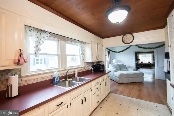 a very nice looking living room with wooden floors and a large window